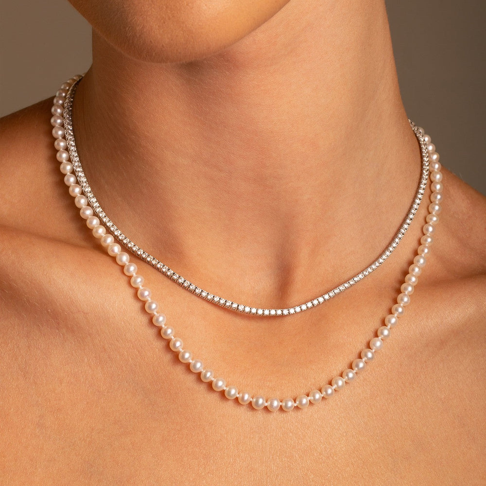 Fresh styling of classic pearl strand layered with diamond tennis necklace from the Everpearl collection