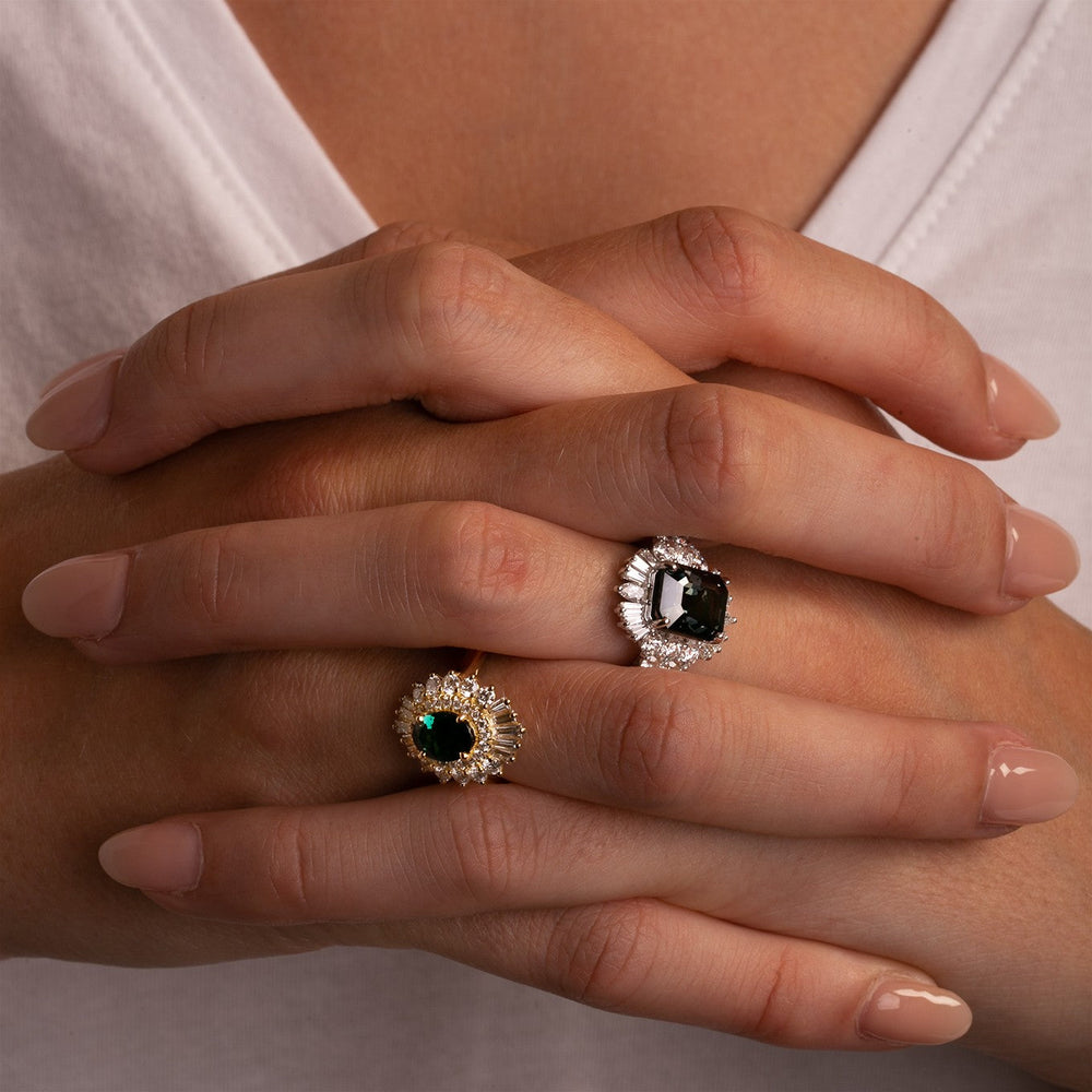 Model styled in sculptural 18k gold gemstone rings featuring black spinel, diamonds, and green tourmaline from the Thomas Laine High Color collection
