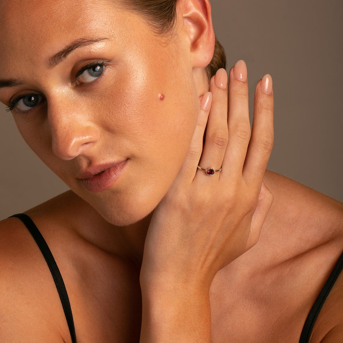 14K Yellow Gold Heart Ring with Rhodolite Garnet on model