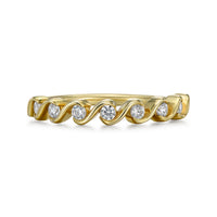 Lira swirl bezel diamond band with seven 2.0 mm round diamonds in open swirl bezels on a 1.7 mm slender low-profile band - shown in 18k yellow gold