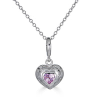Luxurious 14k White Gold, this petite charm showcases a vibrant pink sapphire, echoing the intense hues of passion and romance, while delicate diamonds frame its edges, adding a touch of timeless sophistication.