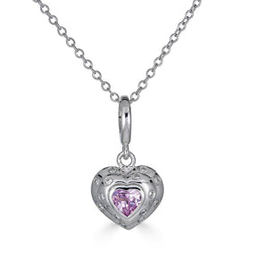Luxurious 14k White Gold, this petite charm showcases a vibrant pink sapphire, echoing the intense hues of passion and romance, while delicate diamonds frame its edges, adding a touch of timeless sophistication.
