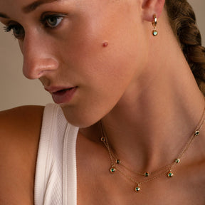 Layered Bezel Set Emerald Necklaces - 14K Yellow Bezel Emerald Gypset Hoops on ModelThomas Laine Jewelry