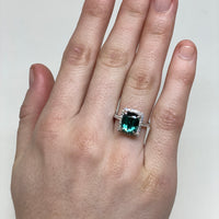 On Model 14k White Gold Green Cushion Cut Tourmaline in a diamond halo and accented band