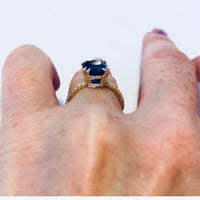 Low profile view on model 18K Yellow Gold Cushion Cut Peacock Blue Spinel Engagement Ring