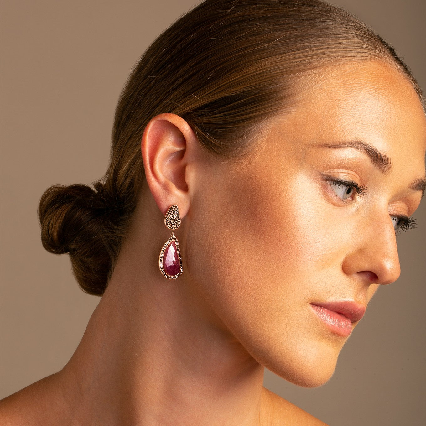 14k Rose Gold Ruby Slice and Black Diamond Drop Earrings on model Thomas Laine Jewellery