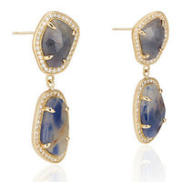18K yellow gold, these one-of-a-kind earrings are designed to emphasize the wild and raw beauty of the natural sapphires.