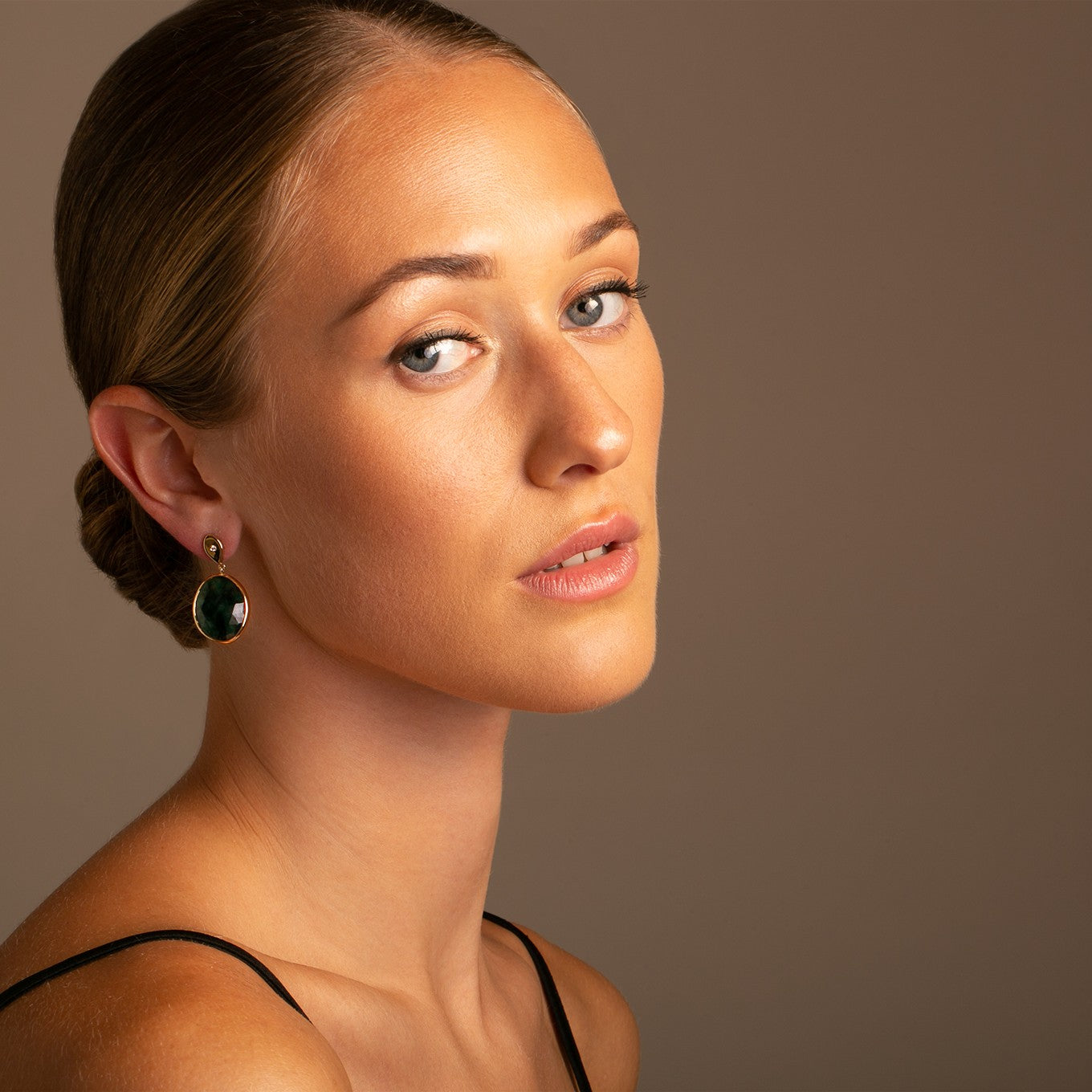 Exquisite Emerald Slice Earrings on Model