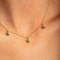14K Yellow Gold Bezel Set Emerald Drop Neckace close up profile view- Thomas Laine Jewelry