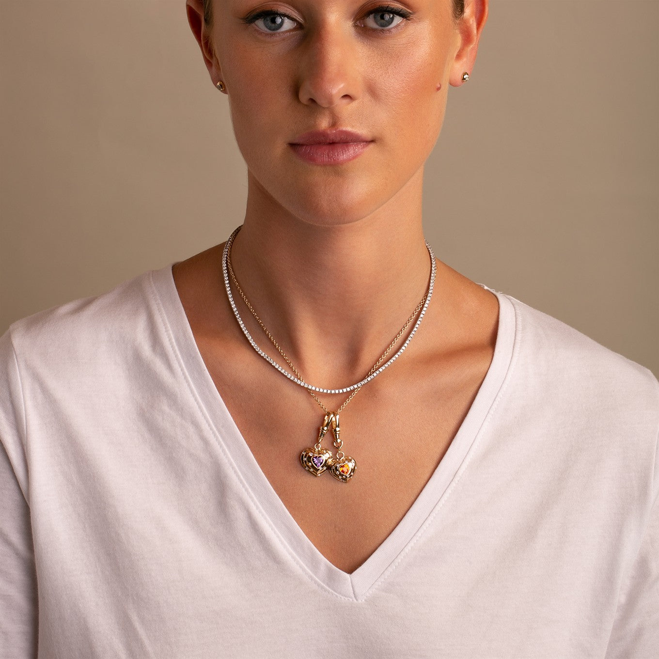 14k Yellow Gold, Natural Vibrant Amethyst and Diamond Heart Charm with Vintage-Inspired Dog Clip  on model styled with white tee-shirt and diamond tennis necklace