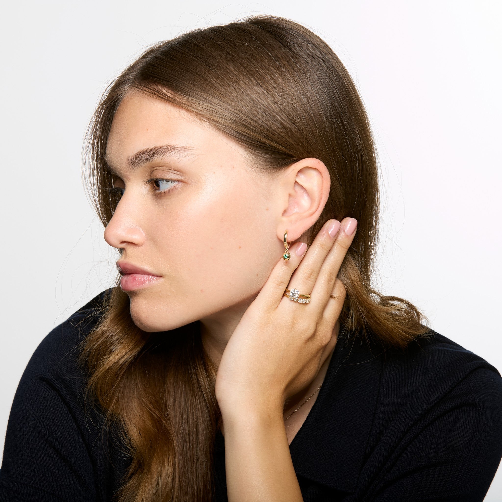 Model wearing Compass Solitaire old mine cut diamond ring styled with minimal gold Jewellery
