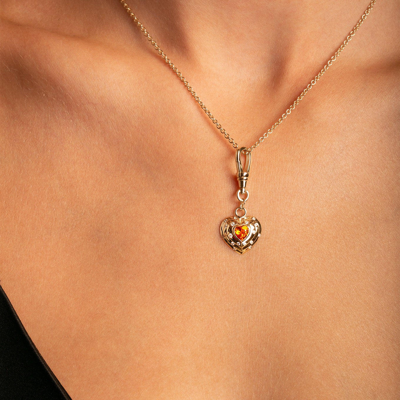 14k Yellow Gold Orange Spessartite Garnet Diamond Heart Charm with Vintage-Inspired Dog Clip on cable chain on model