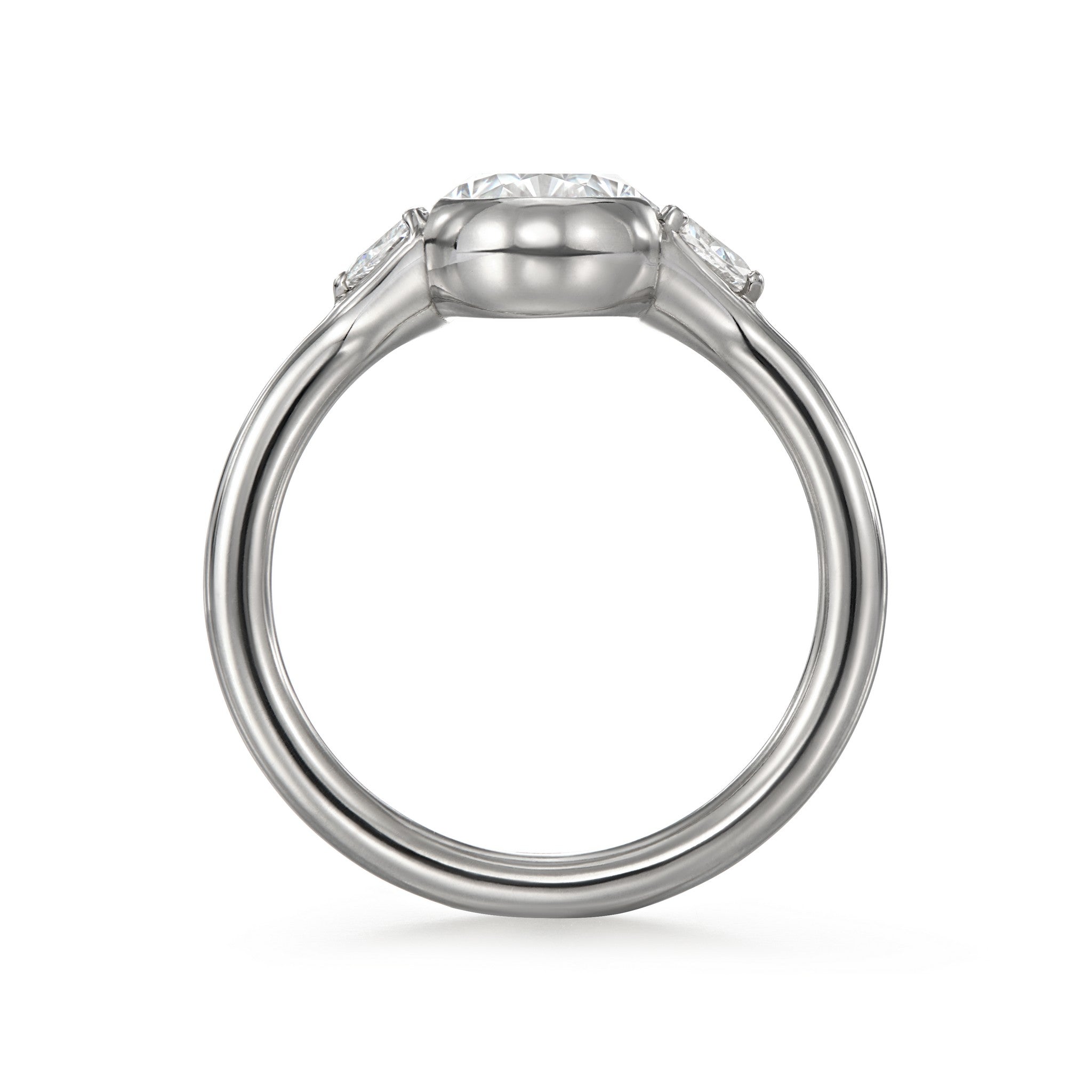 Side view of Cael Three Stone Oval & Trillion Engagement Ring showing low profile round wire band