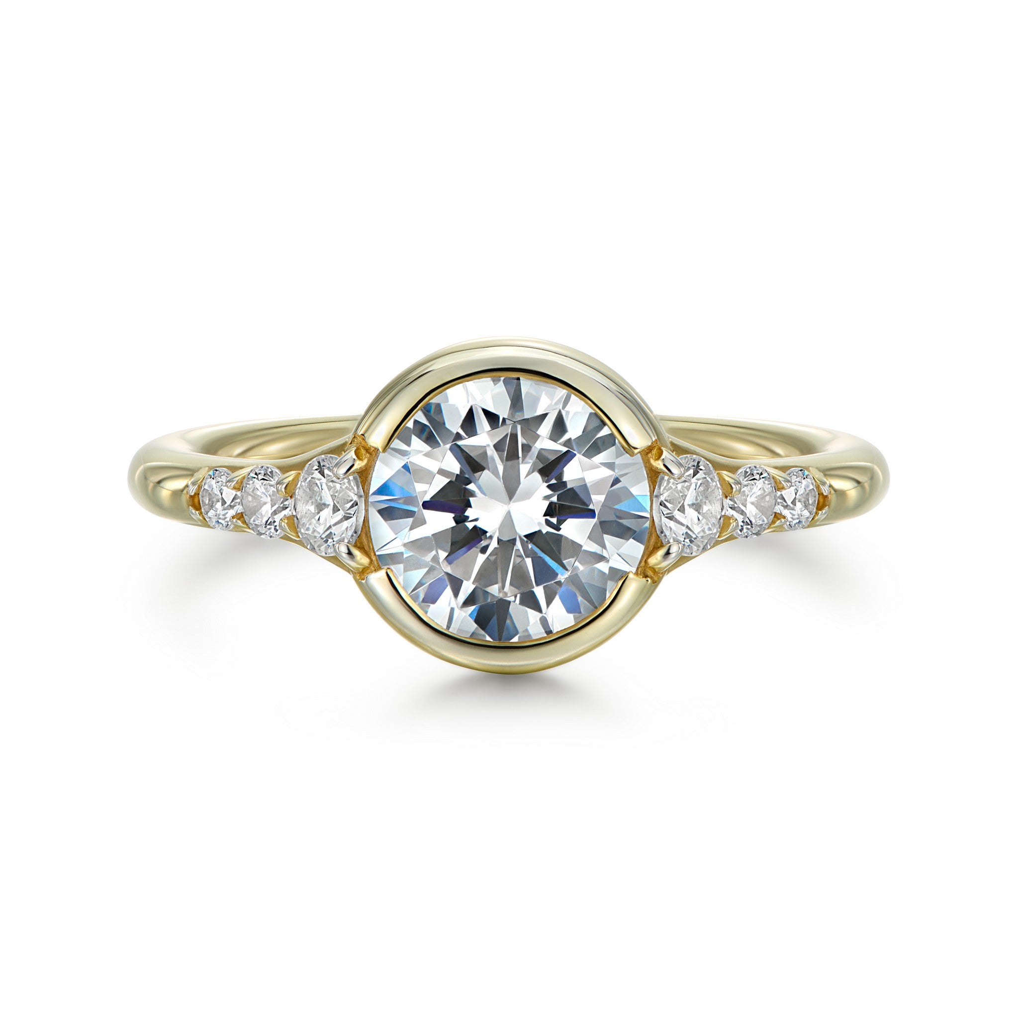 Cael round diamond solitaire with open bezel and graduated diamond shoulders in 18k yellow gold