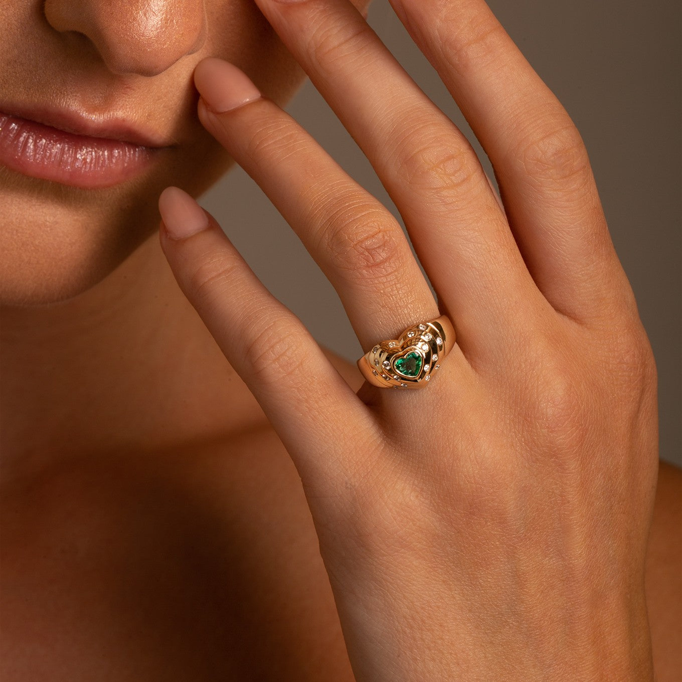 14k Yellow Gold Emerald and Diamond Heart Ring another view on model