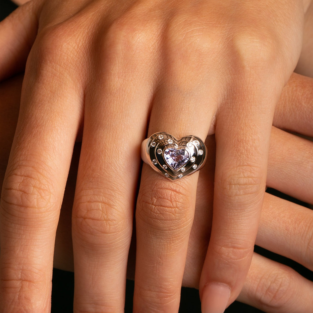 14k White Gold G.IA Certified Natural Lavender Spinel and Diamond Heart Ring close up on Model's hand