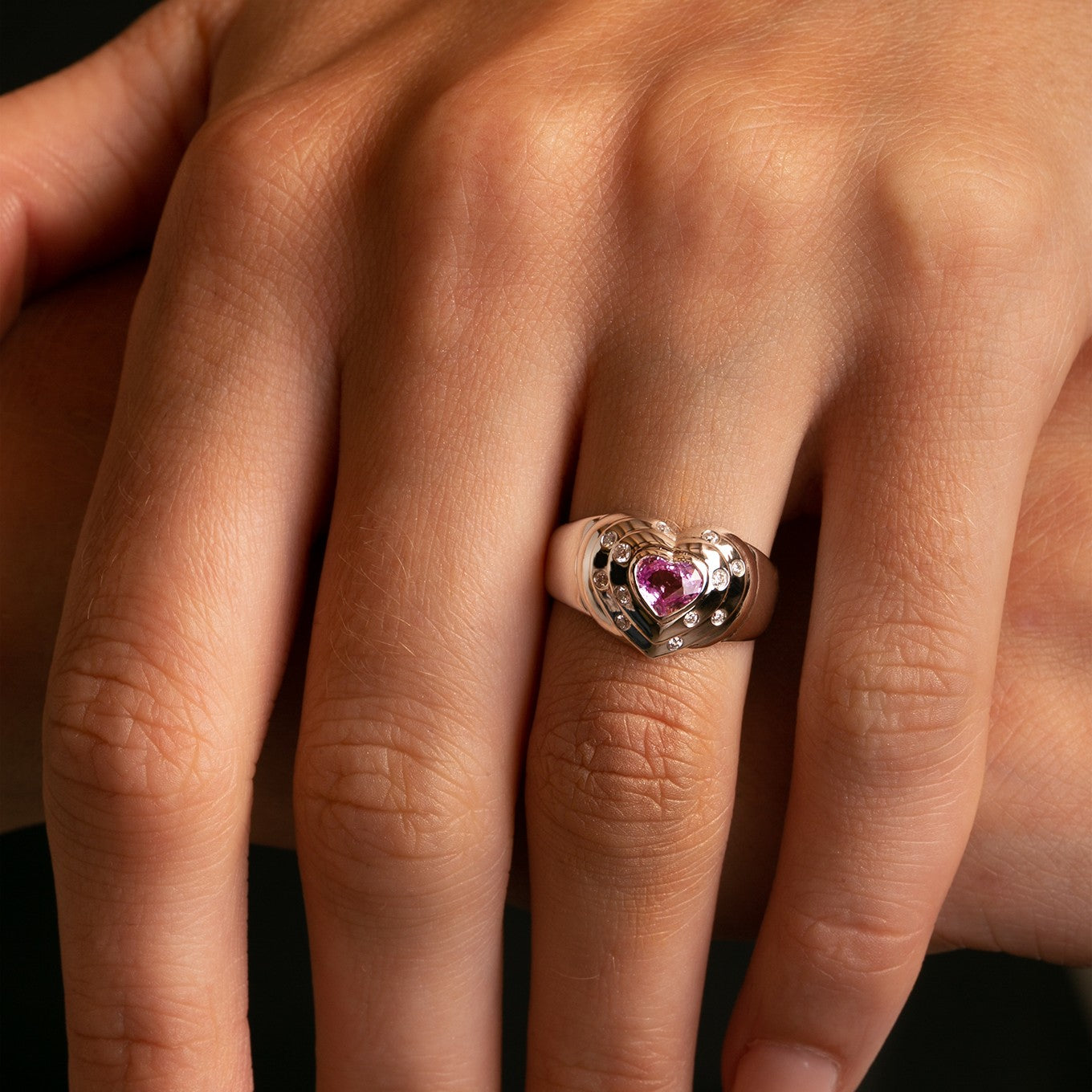 14k White Gold Natural Pink Sapphire and Diamond Heart Ring close up on model