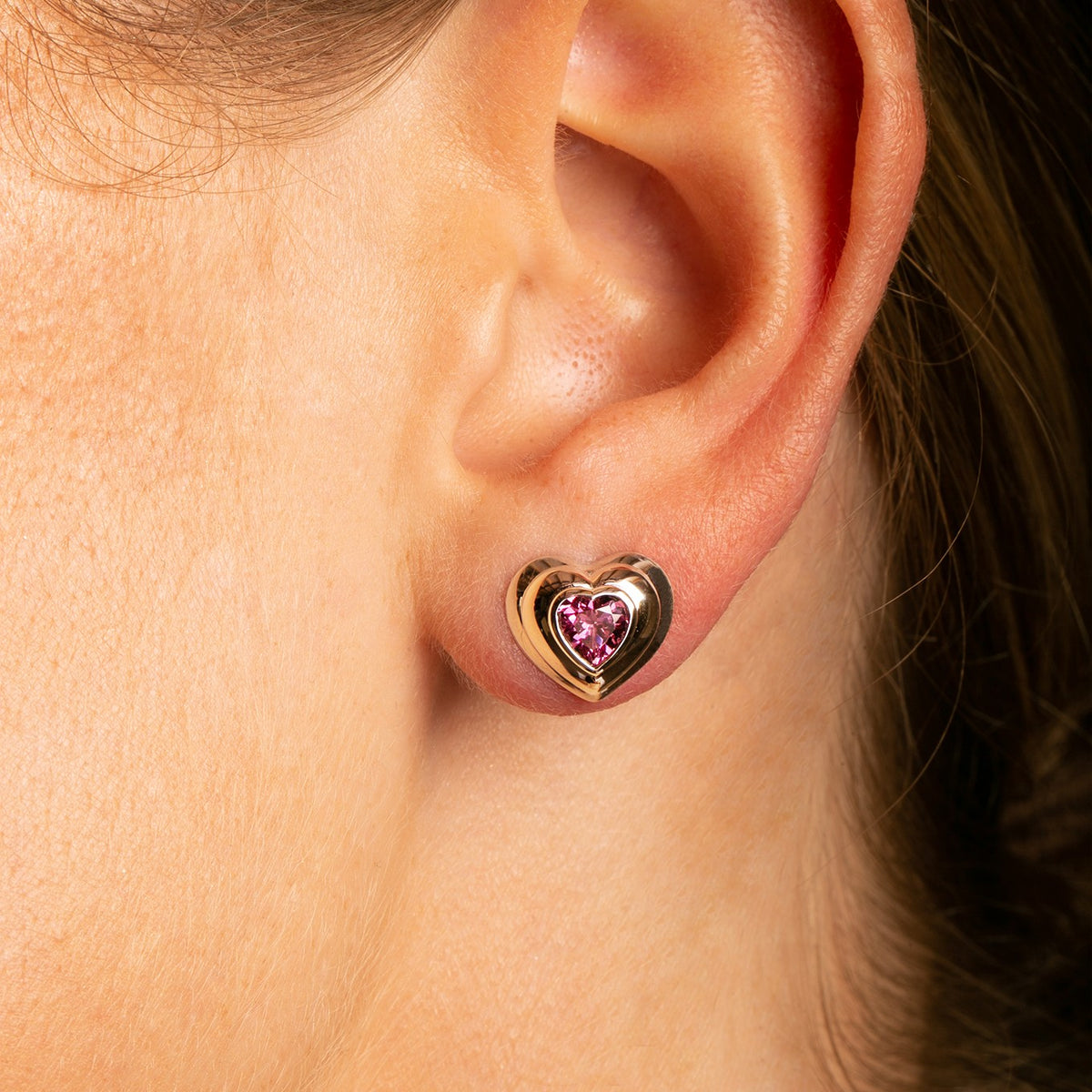 14k White Gold Rhodolite Garnet Heart Stud Earrings close up on model