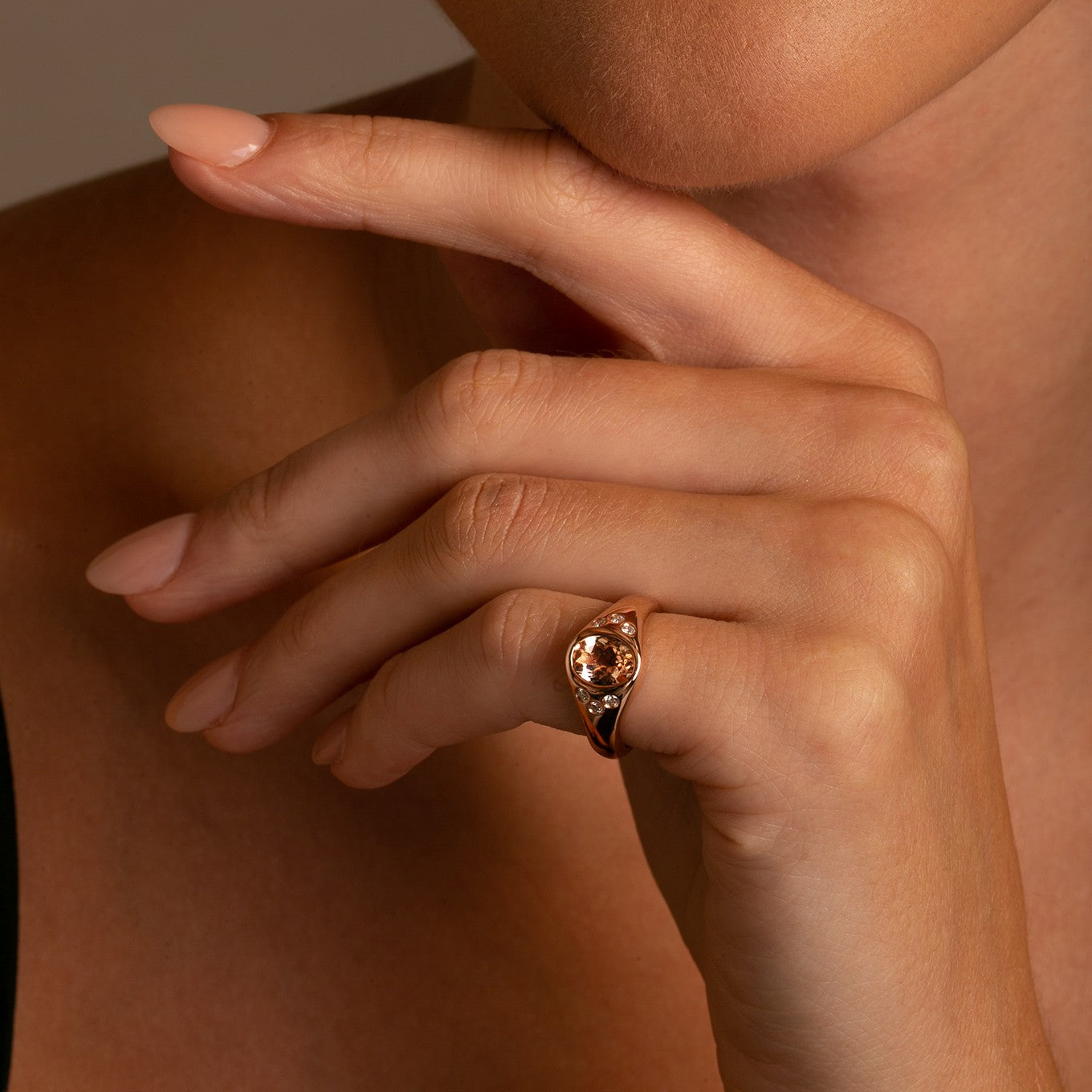 Close up on model 14k Rose Gold Morganite and Diamond Pinky Signet Ring on model