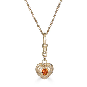 14k Yellow Gold Orange Spessartite Garnet Diamond Heart Charm with Vintage-Inspired Dog Clip close up on chain