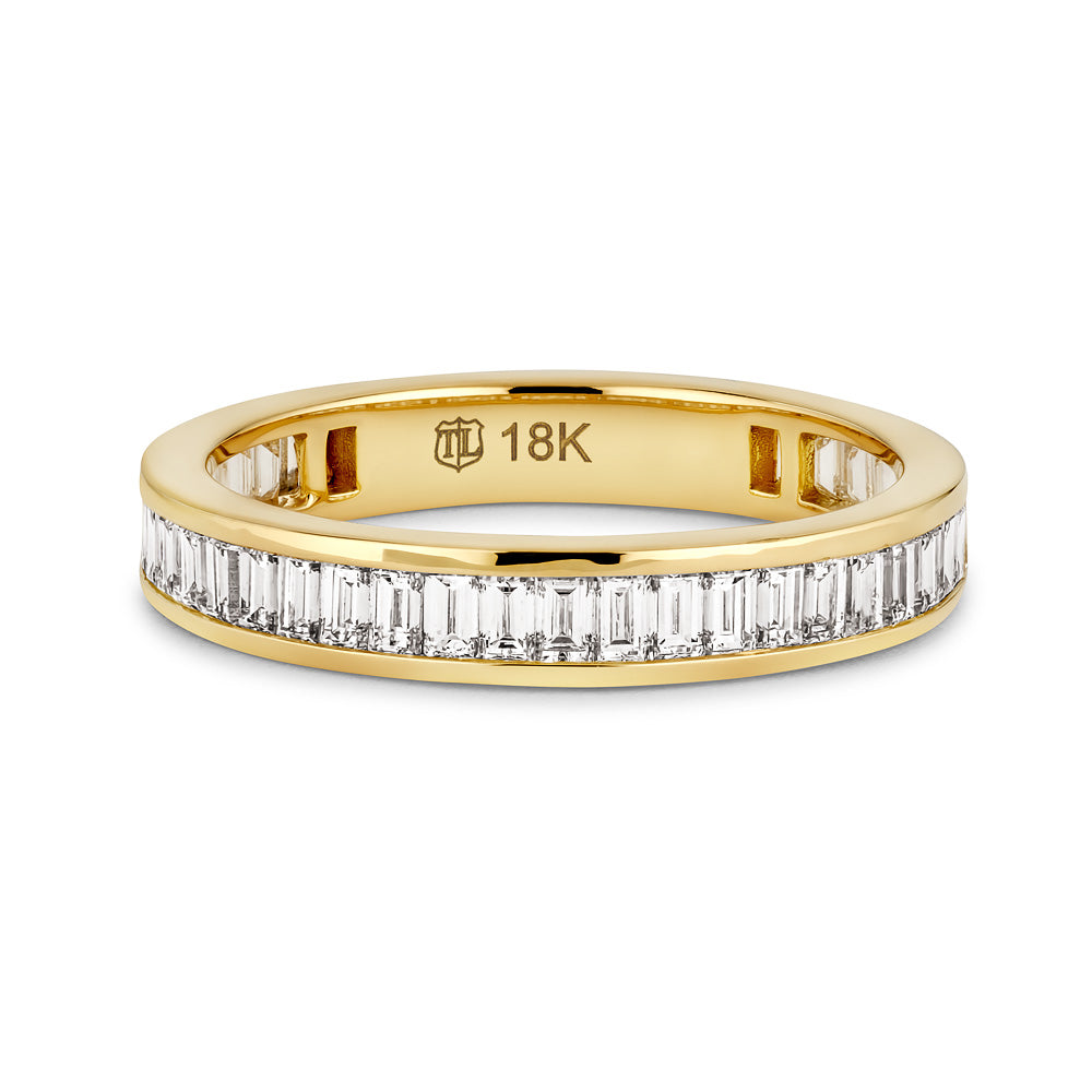 18K Gold Channel Set Vertical Baguette Diamond Band - a true embodiment of modern luxury. Crafted from premium 18K gold, this band features a sleek and contemporary design with vertical baguette diamonds set in a seamless channel