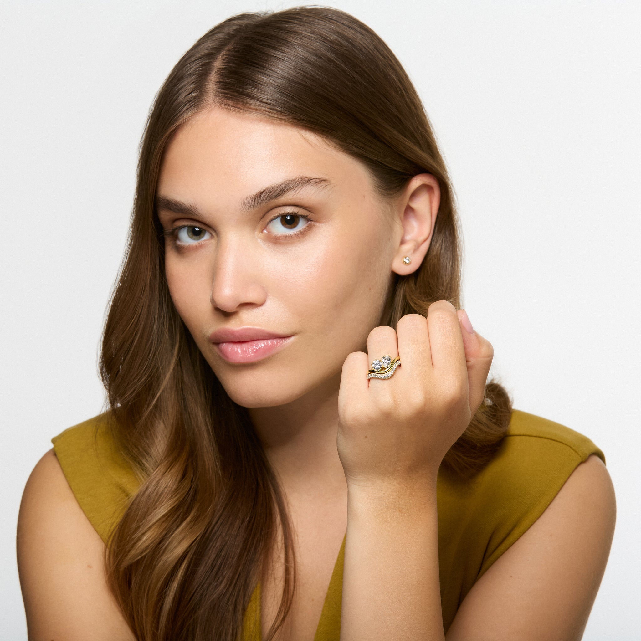 Wave Toi et Moi diamond ring worn on hand, pear and round diamonds in yellow gold by Thomas Laine 
Shown sitting flush with pave diamond wave band