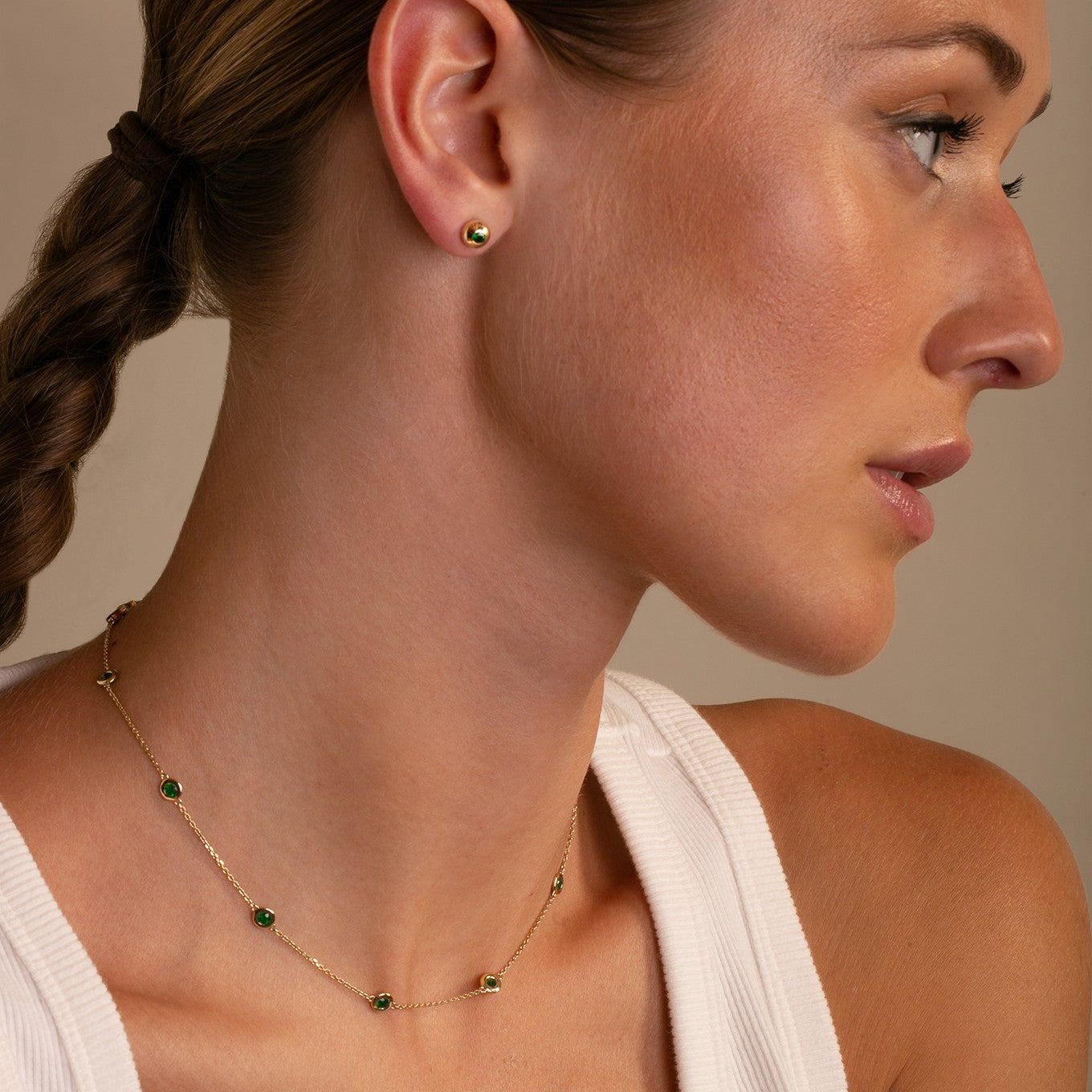 Ten Stone Bezel Set Emerald Necklace with Bezel Set Emerald Dome Studs  styled with a vest