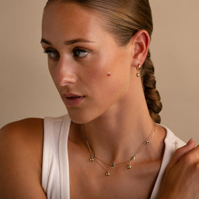 Layered Ten Stone Bezel Set Emerald Necklace  and Emerald Gypset Hoops on Model - Thomas Laine Jewelry