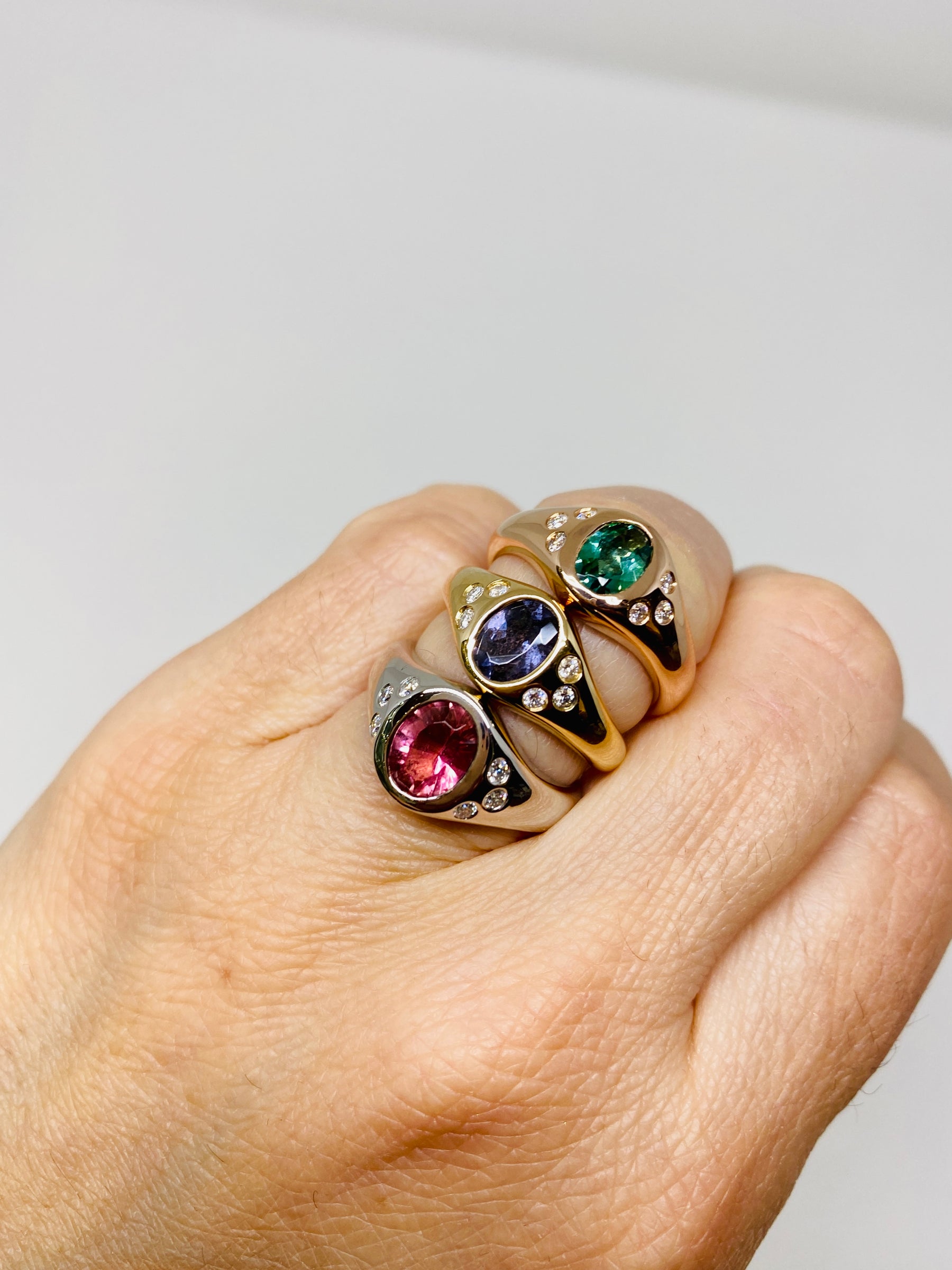 Stack of modern Signet Rings on model