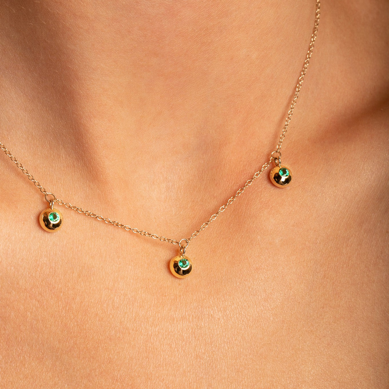 14K Yellow Gold Bezel Set Emerald Drop Neckace  close up profile view- Thomas Laine Jewelry