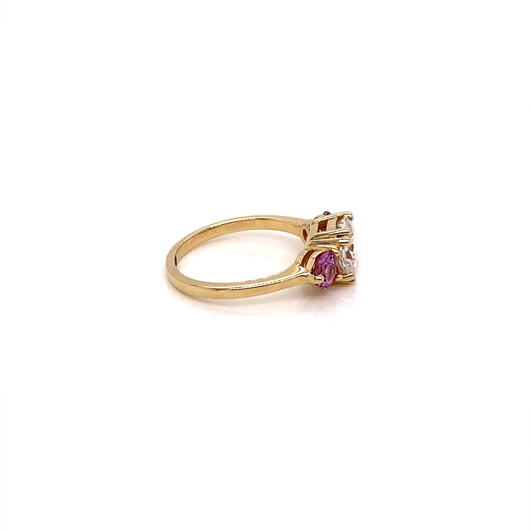 Three-Stone rings features  Cushion Cut Moissanite and two natural round pink sapphires