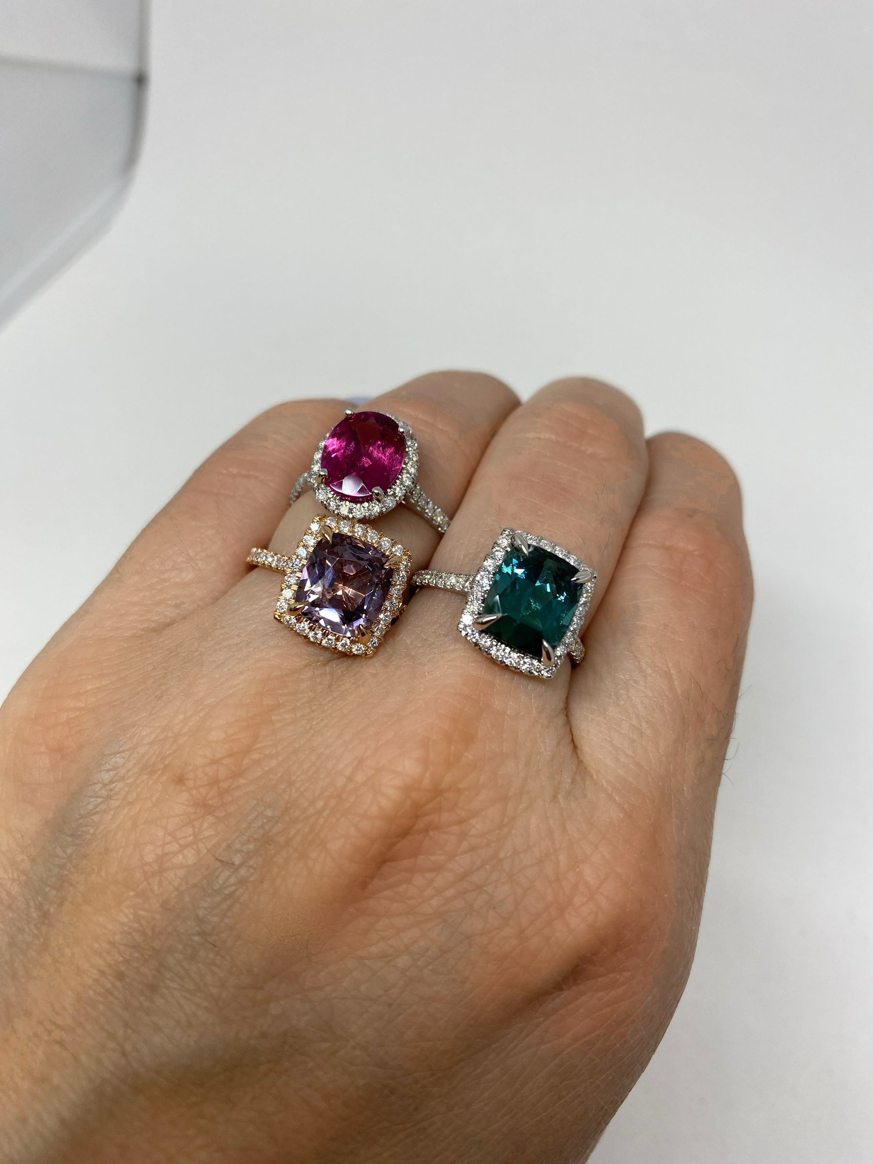 18K Rose Gold Diamond Halo 3ct Lavender Spinel Ring styled with tourmaline halo rings on model